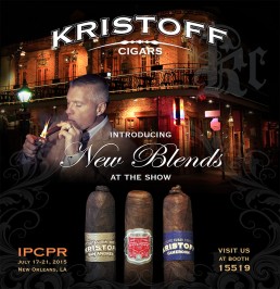 Man lighting cigar against a vintage building at night, promoting Kristoff Cigars' new blends. Booth 15519 at IPCPR, July 2015, New Orleans.