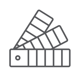 Gray icon of a fanned-out color swatch against a black background. The swatch has five rectangles and a circular hole, suggesting design and creativity.